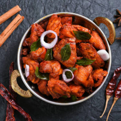 Fried chicken Kebab or Kabab, Chicken Tikka Masala on dark black background Bangalore Hyderabad South India. Top view of Indian non veg food.