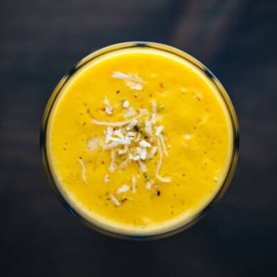 Glass of mango lassi view from above. North Indian food